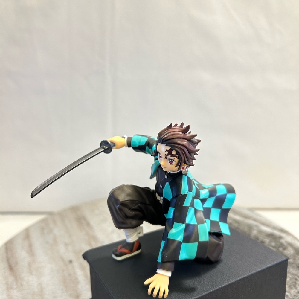 Anime Figure with Sword and Checkered Outfit